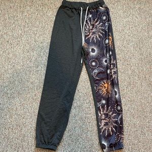 SHEIN size small asymmetrical sweat pants with suns and moons on leg